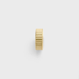 Gold spacer bead on a white background