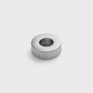 Silver fluted spacer beads on a light gray background