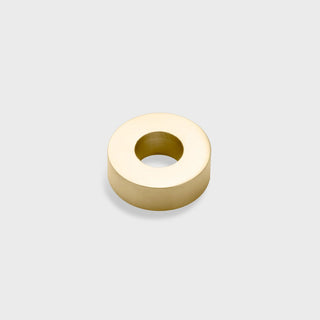 Gold spacer bead on a light gray background