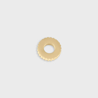 Gold textured spacer bead on a light gray background