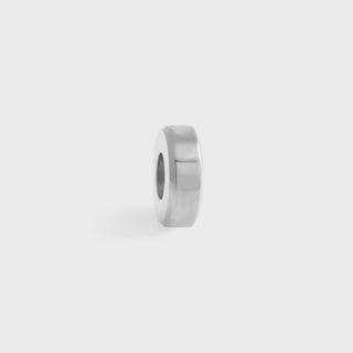 Silver spacer bead on a light gray background