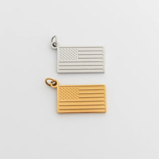 Gold and silver American flag pendants on a light gray background