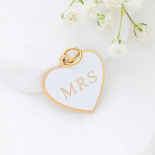 Heart-shaped pendant with 'MRS' on a white background