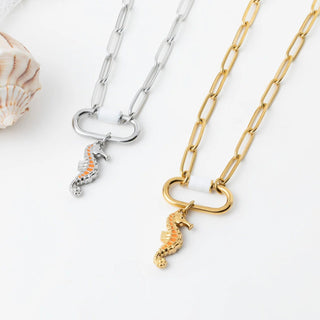 Two chain necklaces with seahorse charms on a white background