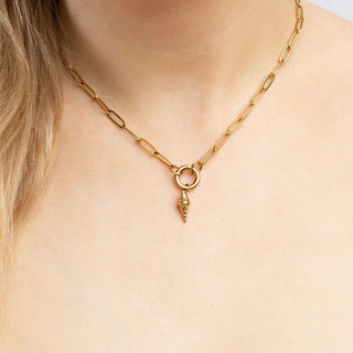 Gold chain necklace with an ice cream pendant on a person's neck