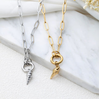 Two chain necklaces with ice cream cone pendants on a white surface