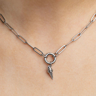 Silver chain necklace with an ice cream cone pendant on a person's neck