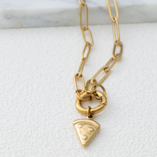 Gold chain necklace with a pizza slice charm on a white marble surface