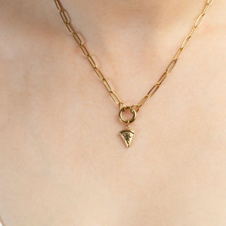 Gold necklace with a pendant on a person's neck
