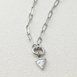 Silver necklace with a pizza slice charm on a light gray background