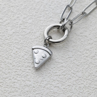 Silver necklace with a pizza slice charm on a light gray background