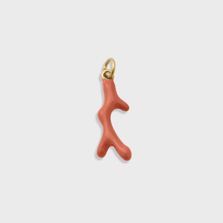 Coral-colored coral branch-shaped pendant with gold accent on a light gray background