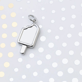 Silver popsicle pendant on a polka dot background