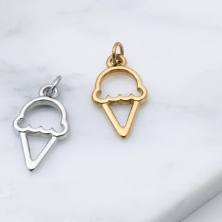 Gold and silver ice cream cone pendants on a light gray background