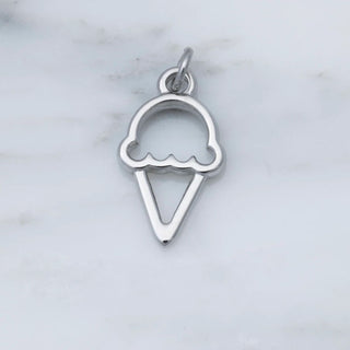 Silver ice cream cone pendant on a marble background