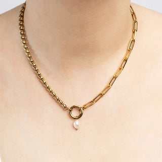 Gold chain necklace with a pearl pendant
