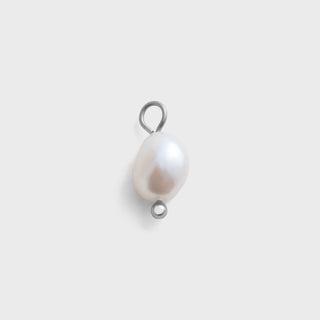 Pearl pendant with silver ring on a light gray background