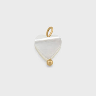 Gold Heart Shell Charm on a light gray background