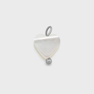 Shell Heart Charm on a light gray background