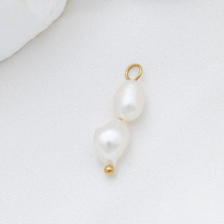 Pearl pendant with gold clasp on a white background