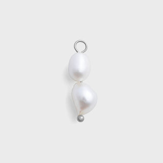 Pearl pendant on a light gray background
