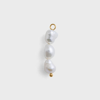 Three pearl beads with gold clasps on a white background
