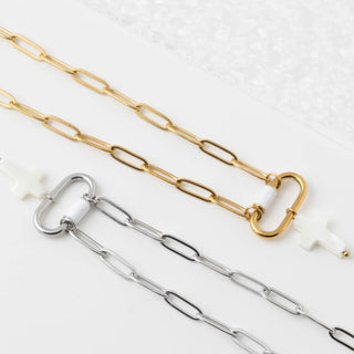 Gold and silver chain necklaces on a white background