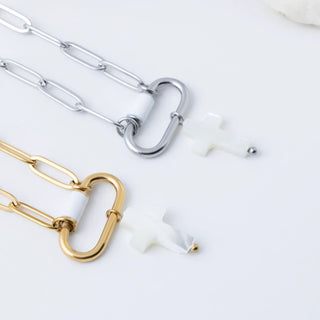 Gold and silver chain necklaces on a white background