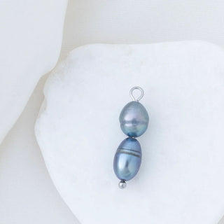 Black pearl pendant on a white background